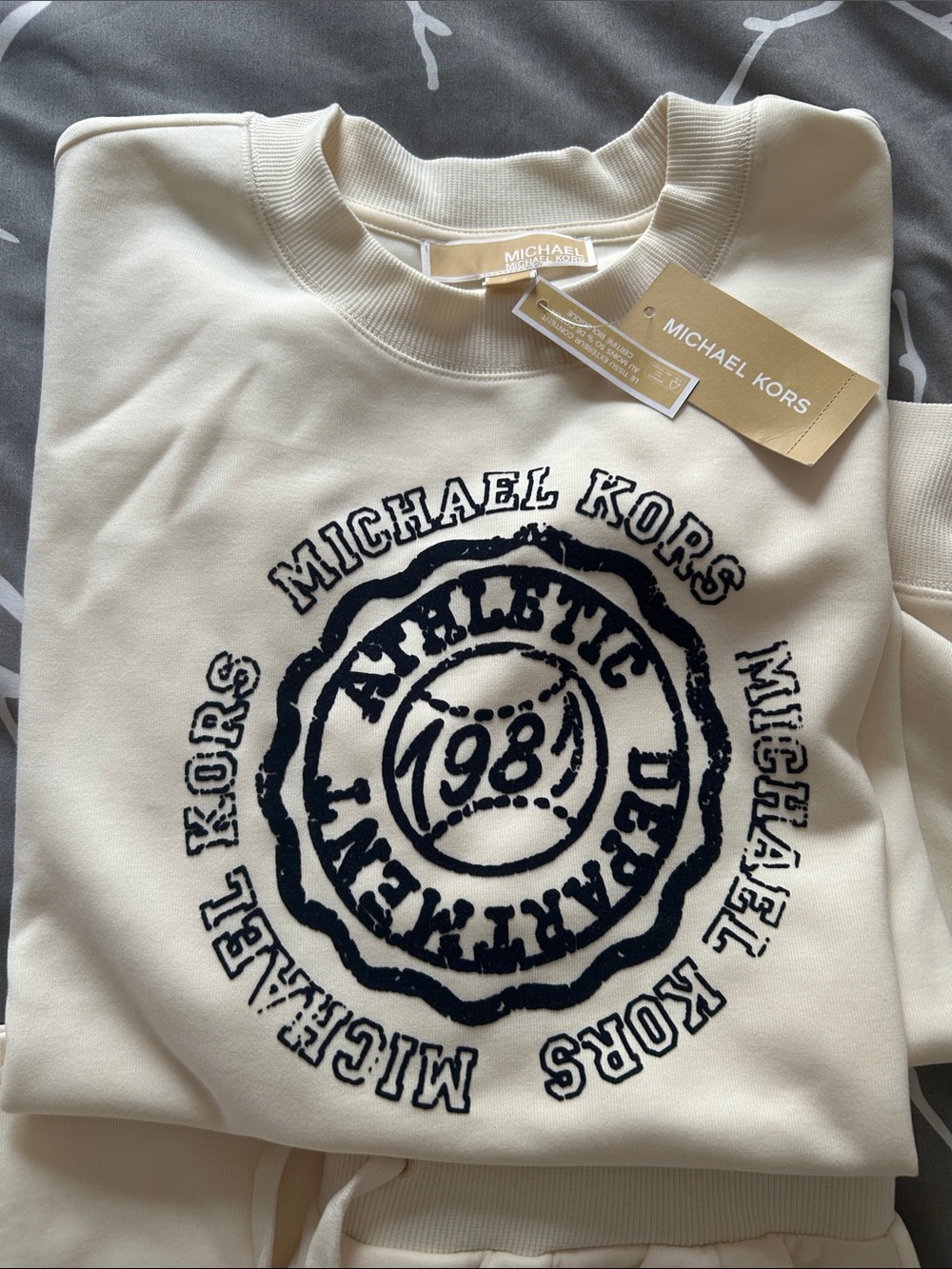 Michael Kors  2 piece Cream Crewneck Sweatshirt with Navy Athletic Seal and pant